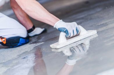 Smoothing surface of the concrete floors of a commercial building in Frankston VIC.